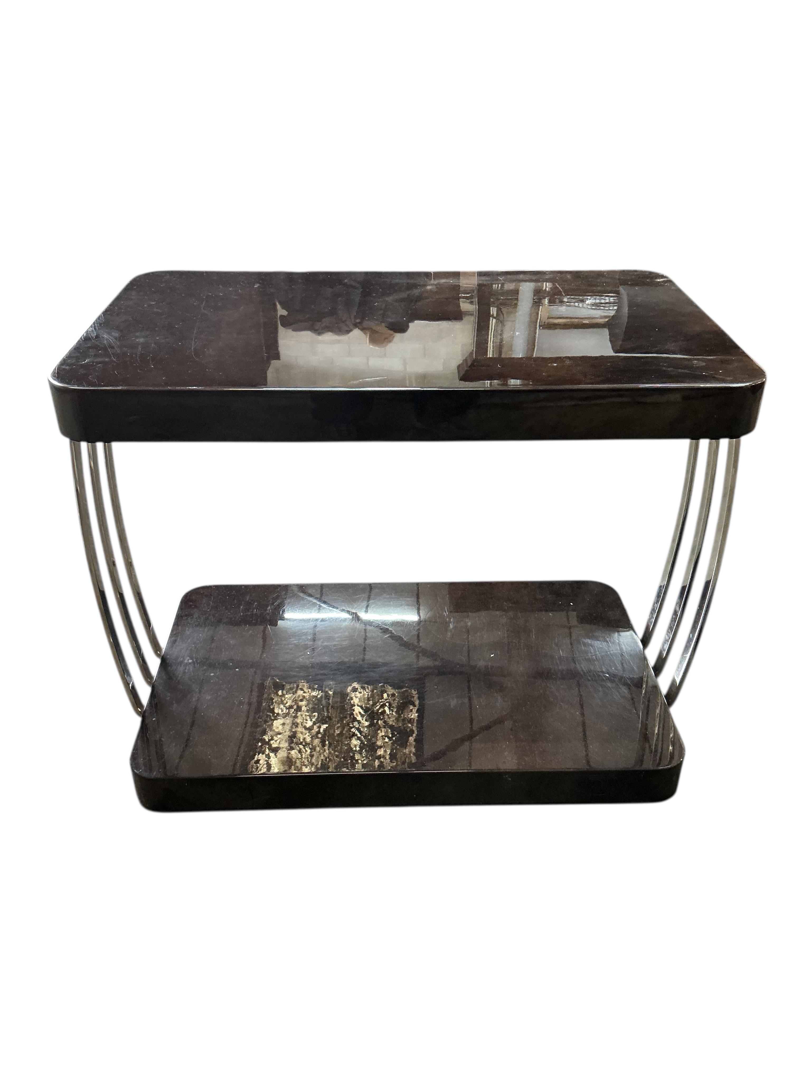Sally Sirkin Lewis for J Robert Scott, a pair of rectangular Art Deco style lacquer and chrome two tier tables, width 84cm, depth 51cm, height 66cm